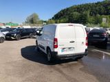 a white van that is parked in a parking lot