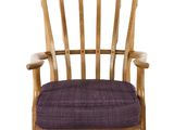 a wooden chair with a purple cushion on it