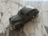 a toy car that is sitting on a marble table
