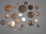 a lot of coins that are on the table