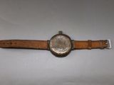 an image of a watch that is sitting on a white surface