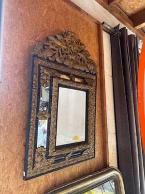 a mirror on the wall next to a mirror on the wall