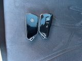 two volkswagen key covers sitting on the seat of a car