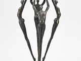 an image of a bronze sculpture of three people holding hands