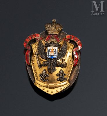 an image of a gold and red shield with a crown on it