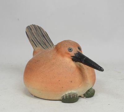 a small bird that is sitting on top of a table