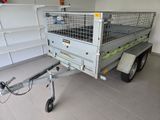 a trailer with a cage on the back of it