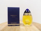 a close up of a bottle of perfume on a table