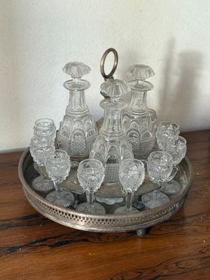 a silver tray with a lot of glasses on it