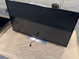 a large flat screen tv sitting on top of a table