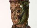 a statue of a woman holding a bird in her hand