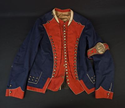a blue jacket with red trim and buttons on a black background