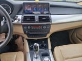 a dashboard of a car with a steering wheel and dashboard controls
