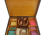 a wooden box filled with different types of soaps