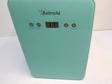 a small clock on the side of a green box