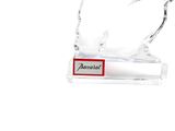 a glass sculpture of a bird with a name tag on it