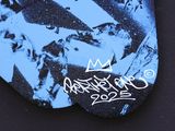 a skateboard that has a picture of a man on it