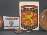 three wooden plates and a plaque on display on a table
