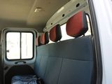 a seat in the back of a van with a bag in the back