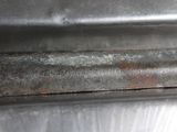 a close up of a piece of metal that has rust on it