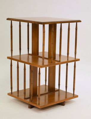 a small wooden shelf with three shelves on it