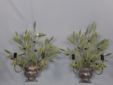 pair of metal wall sconces with green leaves and black candles