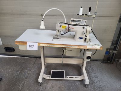 an image of a sewing machine sitting on top of a table
