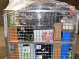 a metal cart with many items in it in a warehouse