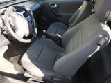 the interior of a car with a steering wheel and a dashboard