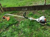 a picture of a string trimmer in the grass