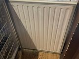 a radiator in the corner of a room that is being remodeled