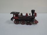 a toy train that is sitting on a white surface