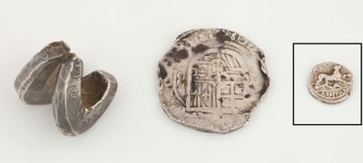 un gros plan d'une pièce de monnaie sur laquelle figure l'image d'un bâtiment