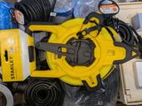 a yellow blower sitting on top of a pile of other items