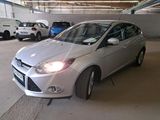 a silver car that is parked in a parking garage