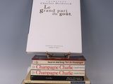books stacked on top of each other on a white surface
