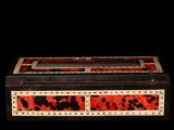 a black box with red and black designs on it