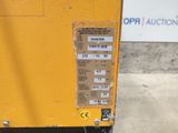 a yellow machine that is sitting on the ground