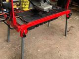 a machine that is sitting on a table in the garage