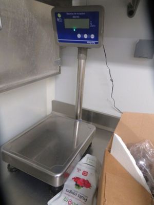 an image of a scale in a kitchen with a box of food