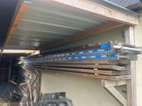 a pile of wood stacked on top of a building