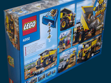 a box of legos with a construction vehicle inside of it