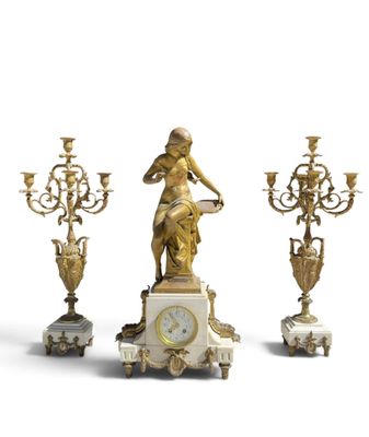 three antique clocks and a statue of a woman on a marble base