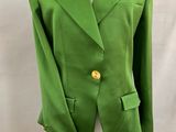 a green blazer jacket on a mannequin mannequin mannequin mannequin mannequin mannequin mannequin mannequin mann