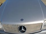 a silver car parked on the side of the road