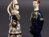 pair of porcelain figurines of a man and a woman