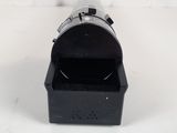 a close up of a camera lens sitting on top of a white surface