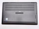 a laptop that is sitting on a white surface