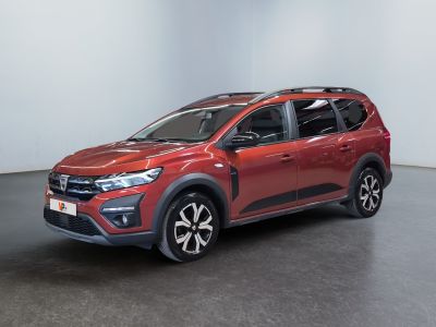 a red toyota rav parked in a room with a black floor