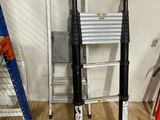 two ladders that are next to each other in a room